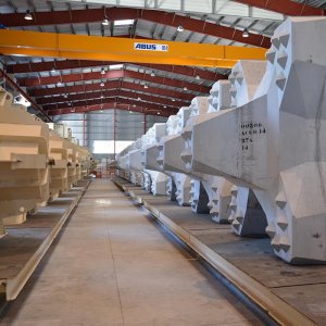 Moulds and concrete elements on the production line of the automated precast plant APS designed for SCPR in La Réunion, France.